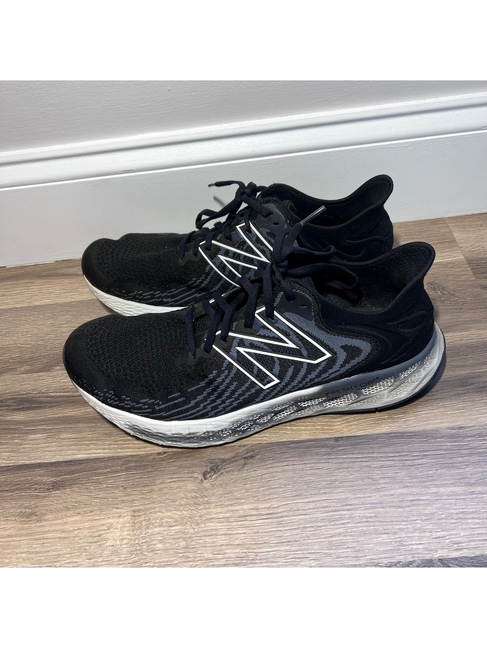 New Balance black and white running shoes, women's size 12